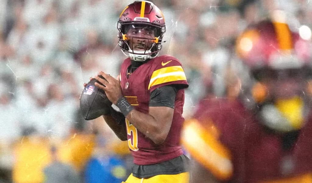 Washington Commanders quarterback surveys the field from the pocket