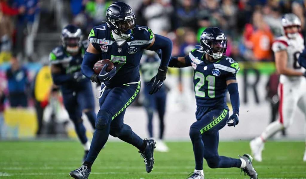 Seattle Seahawks defender returns an interception with a blocker