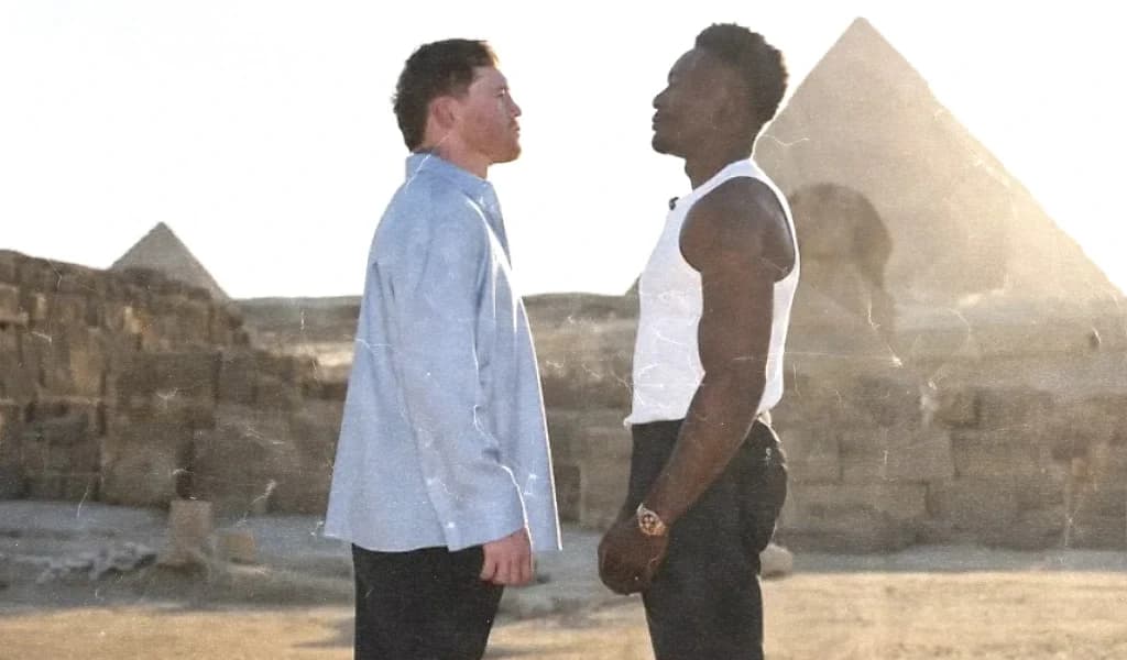 Canelo Alvarez and Christian Mbilli stare each other down in front of the pyramids.
