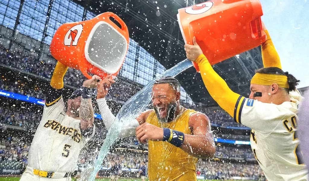 Milwaukee Brewers players dump coolers of water on a teammate