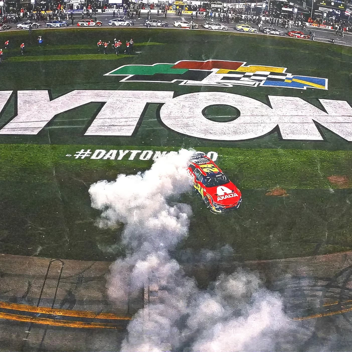 Overhead view of a race car doing a burnout at the Daytona finish line