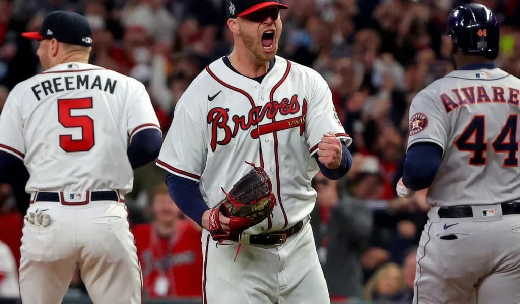 Atlanta Braves pitcher celebrates a World Series out as Freddie Freeman looks on