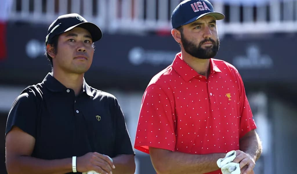 Team USA and International team players look down the fairway at the Presidents Cup
