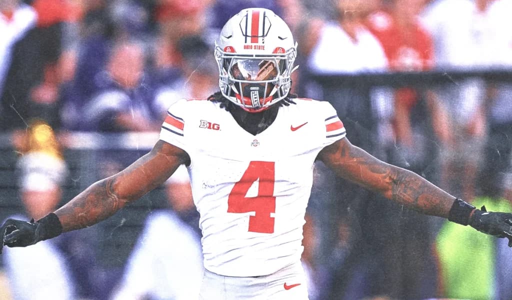 Ohio State defender spreads his arms celebrating a stop