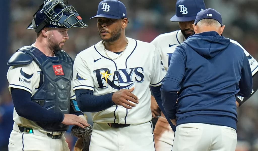 Rays pitcher gets a handshake at the mound during a pitching change