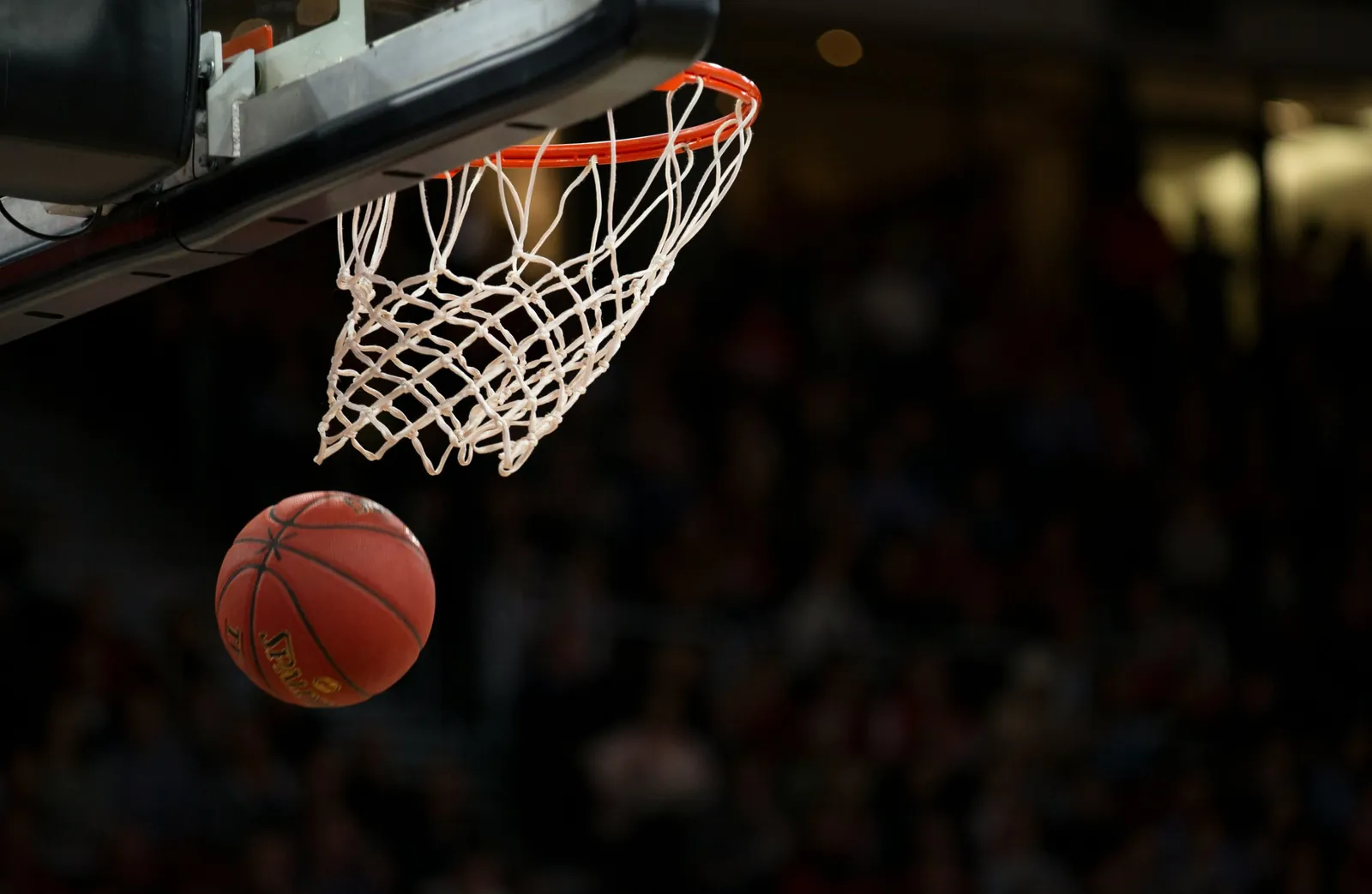 Basketball dropping through the net after a made shot